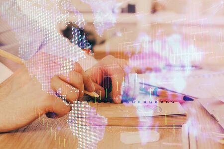 Multi exposure closeup hands with stock market forex graph.の写真素材