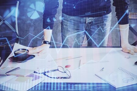 Multi exposure of man standing and planing investment with stock market forex chart.