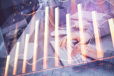 Double exposure of financial graph with man works in office on background. Concept of analysis.の写真素材