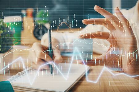 Forex chart displayed on womans hand taking notes background. Concept of research. Multi exposure