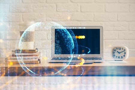 Multi exposure of table with computer and world map hologram. International data network concept.の写真素材