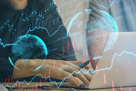 Forex graph with businessman typing on computer in office on background. Concept of analysis. Double...