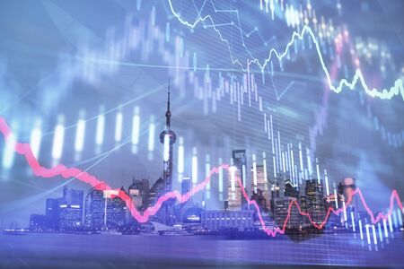 Forex chart on cityscape with tall buildings background multi exposure. Financial research concept.の写真素材