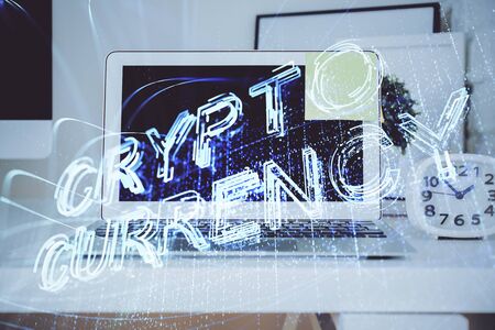 Multi exposure of blockchain theme hologram and table with computer background. Concept of bitcoin crypto currency.の写真素材