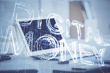 Multi exposure of blockchain theme hologram and table with computer background. Concept of bitcoin crypto currency.の写真素材