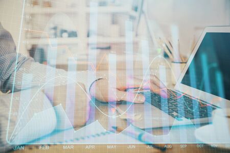 Multi exposure of stock market chart with man working on computer on background. Concept of financial analysis.の写真素材