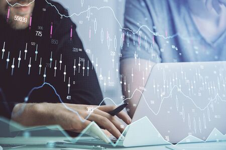Forex graph with businessman typing on computer in office on background. Concept of analysis. Double...