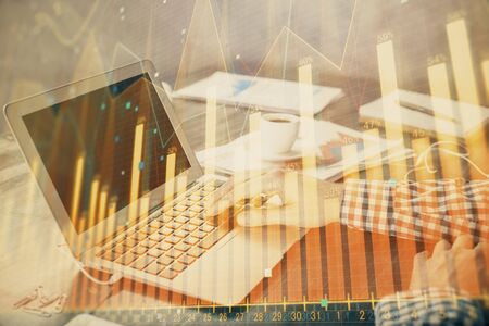 Double exposure of forex chart with man working on computer on background. Concept of market analysis.の写真素材