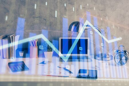 Multi exposure of chart and financial info and work space with computer background. Concept of international online trading.の写真素材