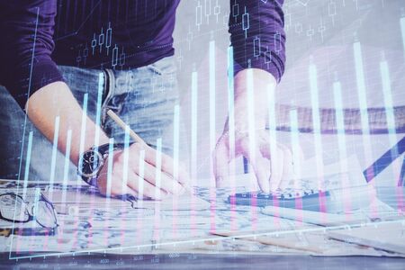 Multi exposure of man standing and planing investment with stock market forex chart.