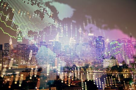 Double exposure of forex chart drawings over cityscape background. Concept of success.の写真素材