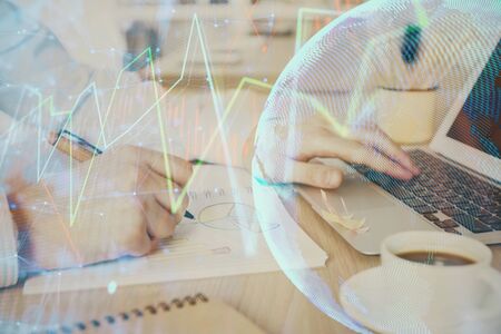 Multi exposure of stock market graph with man working on laptop on background. Concept of financial analysis.の写真素材