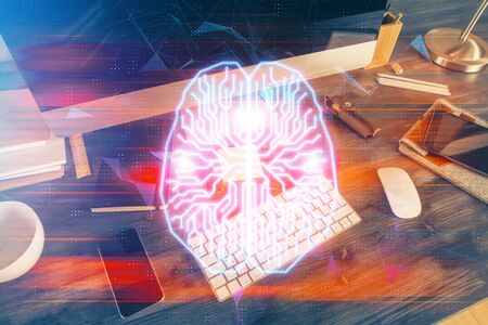Double exposure of table with computer and brain hologram. Data innovation concept.