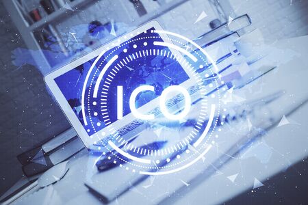Multi exposure of blockchain theme hologram and table with computer background. Concept of bitcoin...