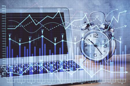 Financial graph colorful drawing and table with computer on background. Double exposure. Concept of...