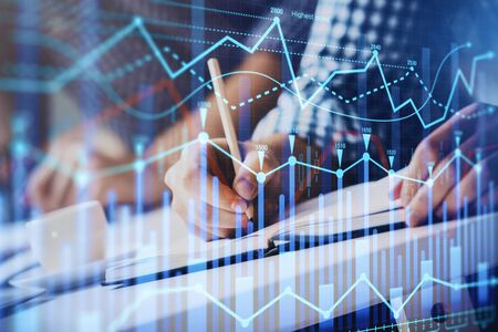 Multi exposure of two men planing investment with stock market forex chart background. Concept of...