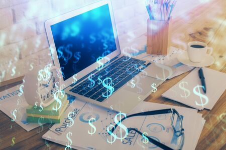 Financial chart drawing and table with computer on background. Multi exposure. Concept of international markets.の写真素材