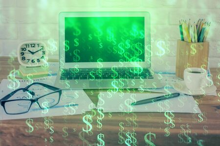 Financial graph colorful drawing and table with computer on background. Double exposure. Concept of international markets.の写真素材