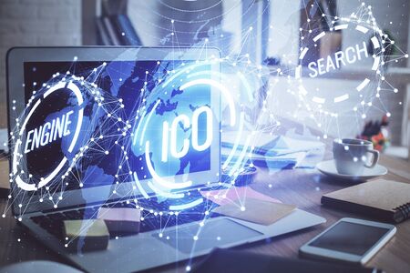 Multi exposure of blockchain theme hologram and table with computer background. Concept of bitcoin crypto currency.の写真素材