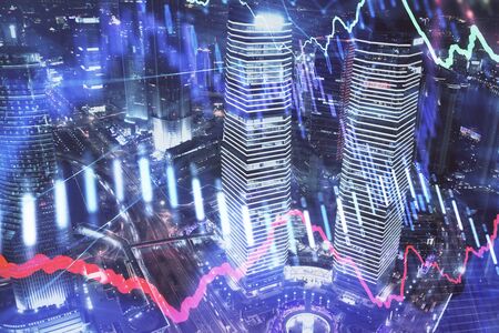 Financial chart on city scape with tall buildings background multi exposure. Analysis concept.の写真素材