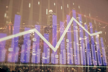 Double exposure of forex chart drawings over cityscape background. Concept of success.の写真素材