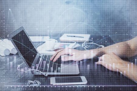 Double exposure of forex chart with man working on computer on background. Concept of market...