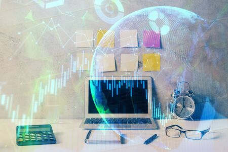 Multi exposure of chart and financial info and work space with computer background. Concept of international online trading.の写真素材