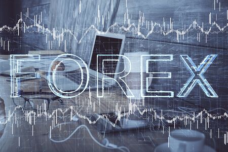 Double exposure of forex graph and work space with computer. Concept of international online trading.の写真素材