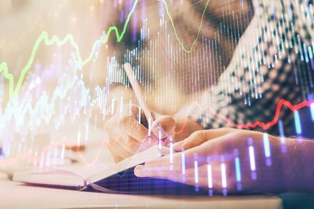 Multi exposure of two men planing investment with stock market forex chart.の写真素材
