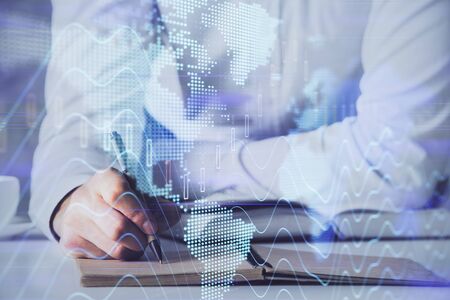 Financial trading chart multi exposure with man desktop background.の写真素材