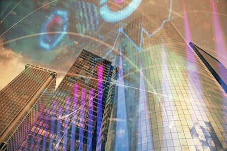 Forex chart on cityscape with skyscrapers wallpaper multi exposure. Financial research concept.の写真素材