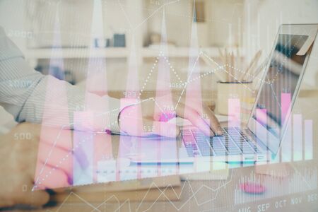 Multi exposure of stock market graph with man working on laptop on background. Concept of financial analysis.の写真素材