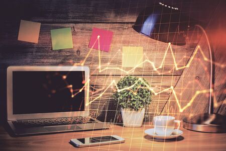 Multi exposure of graph and financial info and work space with computer background. Concept of international online trading.の写真素材