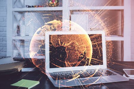 Computer on desktop with social network theme icon. Multi exposure. Concept of international connections.の写真素材