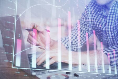 Double exposure of forex graph with man working on computer on background. Concept of market analysis.の写真素材