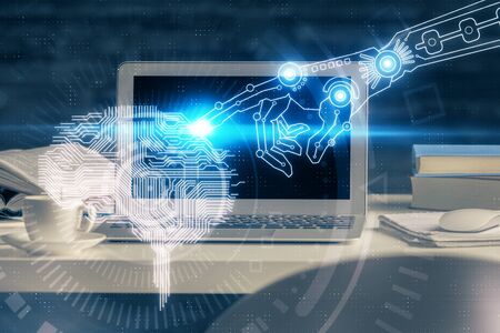 Double exposure of table with computer and brain hologram. Data innovation concept.