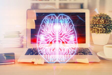 Double exposure of table with computer and brain hologram. Data innovation concept.の写真素材