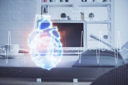 Desktop computer background and heart drawing. Double exposure. Medical study and healthcare concept.の写真素材