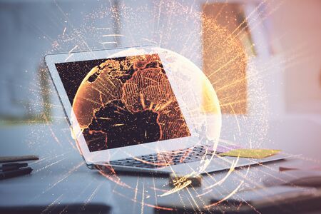 Computer on desktop with social network theme icon. Multi exposure. Concept of international connections.の写真素材