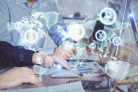 Multi exposure of chart with man typing on computer in office on background. Concept of hard work.