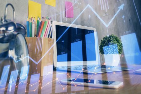 Multi exposure of forex chart and work space with computer. Concept of international online trading.の写真素材