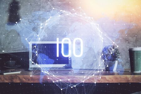 Multi exposure of blockchain theme hologram and table with computer background. Concept of bitcoin crypto currency.の写真素材