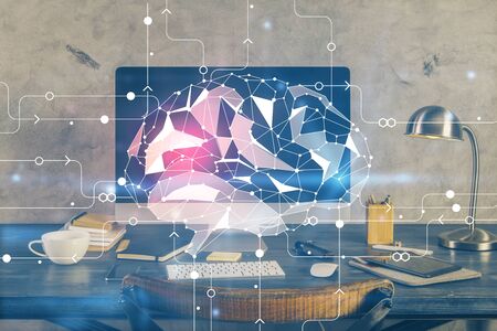 Double exposure of table with computer and brain hologram. Data innovation concept.