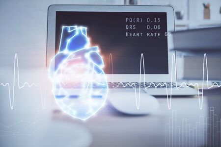 Desktop computer background and heart drawing. Double exposure. Medical study and healthcare concept.の写真素材