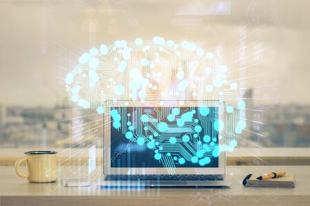 Double exposure of table with computer and brain hologram. Data innovation concept.