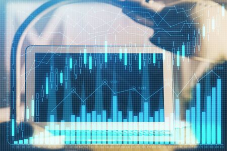 Multi exposure of graph and financial info and work space with computer background. Concept of...