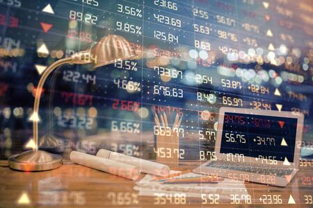 Multi exposure of chart and financial info and work space with computer background. Concept of international online trading.の写真素材