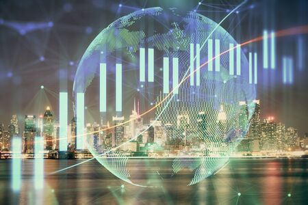 Financial graph on night city scape with tall buildings background multi exposure. Analysis concept.の写真素材