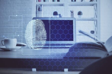 Computer on desktop in office with finger print drawing. Double exposure. Concept of business data...