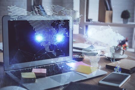 Computer on desktop with social network theme icon. Multi exposure. Concept of international connections.の写真素材